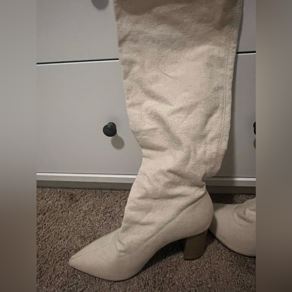Tall, white/cream fabric heeled boots from JustFab